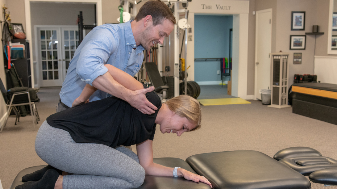 physical therapist working with patient