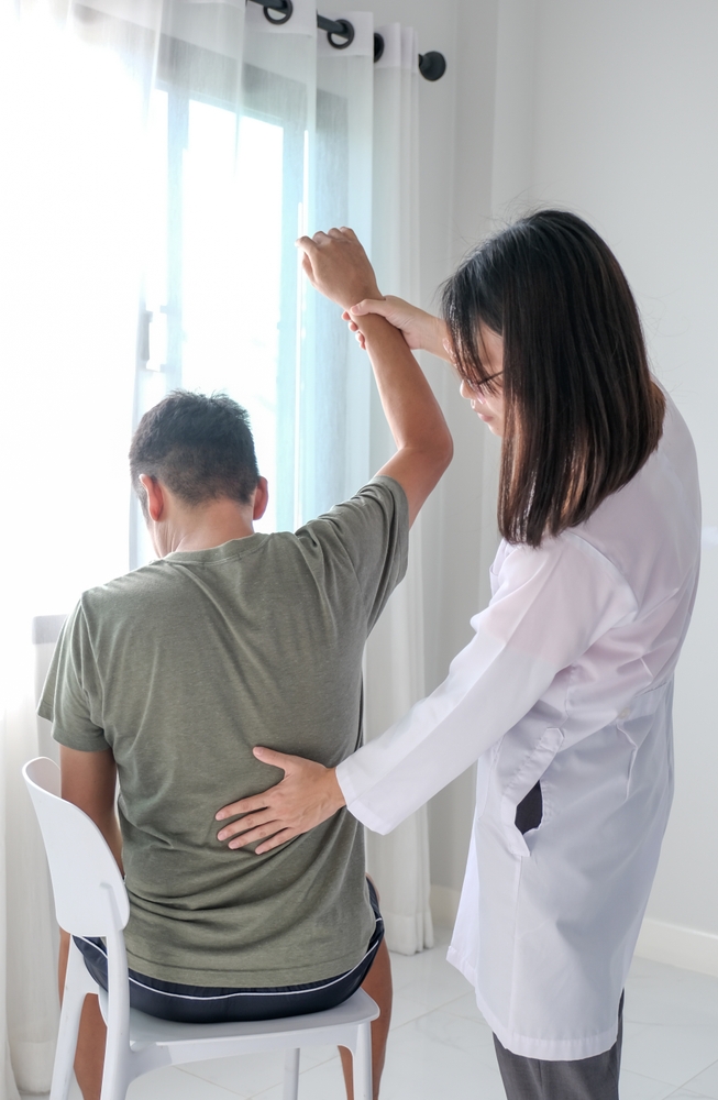 Physical Therapist doing a arm extension