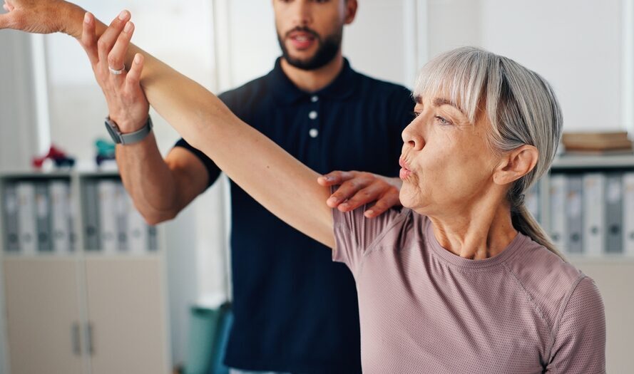 Physical Therapist doing a arm extension